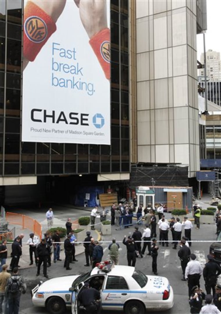 New York City police say an officer shot a man, who had just robbed a Chase bank, outside Madison Square Garden.
